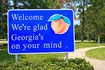 A blue welcome to Georgia road sign