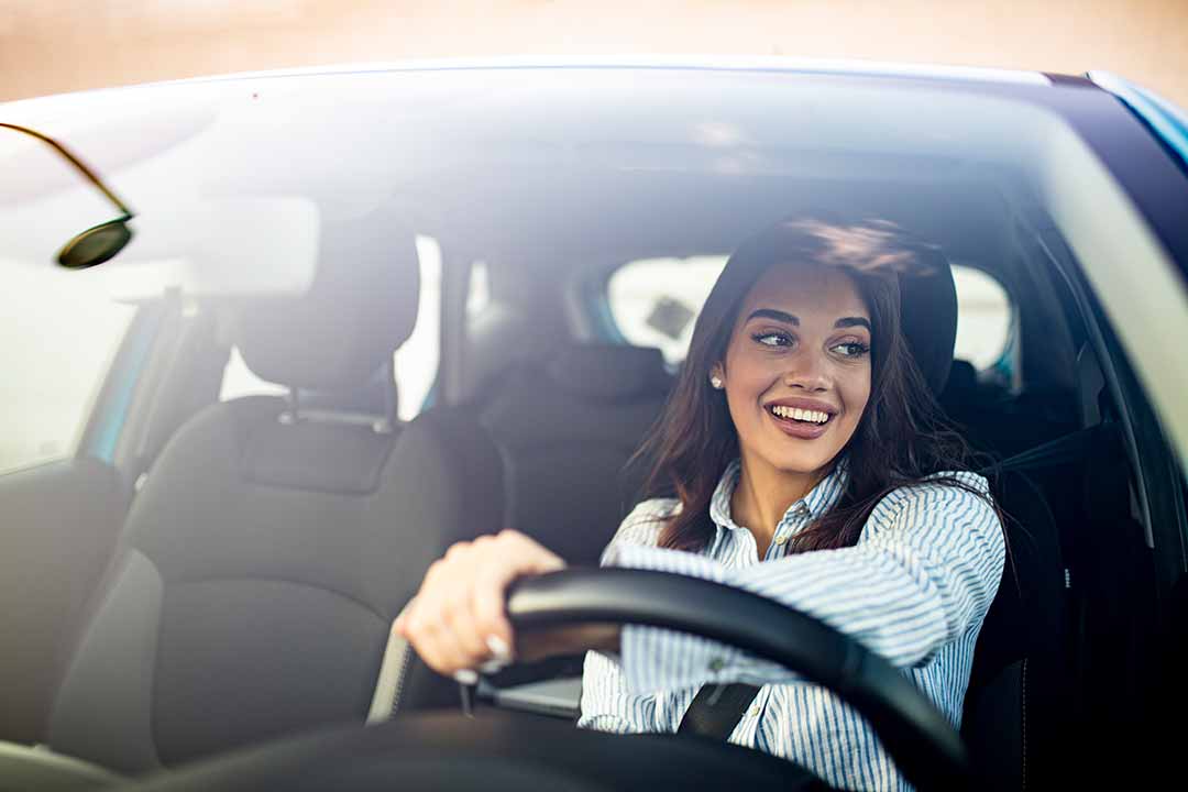 happy woman driving
