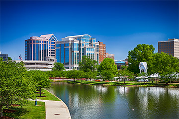 A scenic view of a park and buildings in Alabama on a clear sky day.