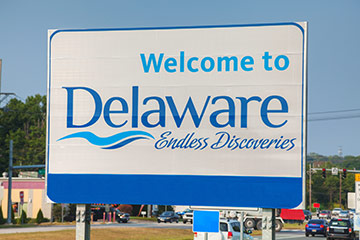 A road sign that reads Welcome to Delaware