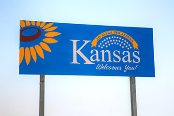 Blue welcome sign of the state of Kansas