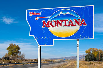 A blue welcome to Montana road sign
