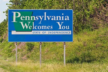 A blue Pennsylvania Welcomes You road sign