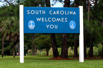 A blue South Carolina Welcomes You road sign